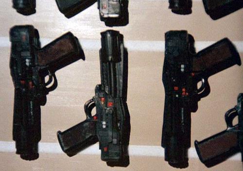 regulation Colonial Service laser pistols--a small arsenal's worth